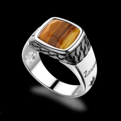 Anello in argento bianco e nero con occhio di tigre naturale.