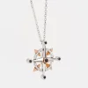 Collana  zancan in oro con pendente rosa dei venti e diamanti.