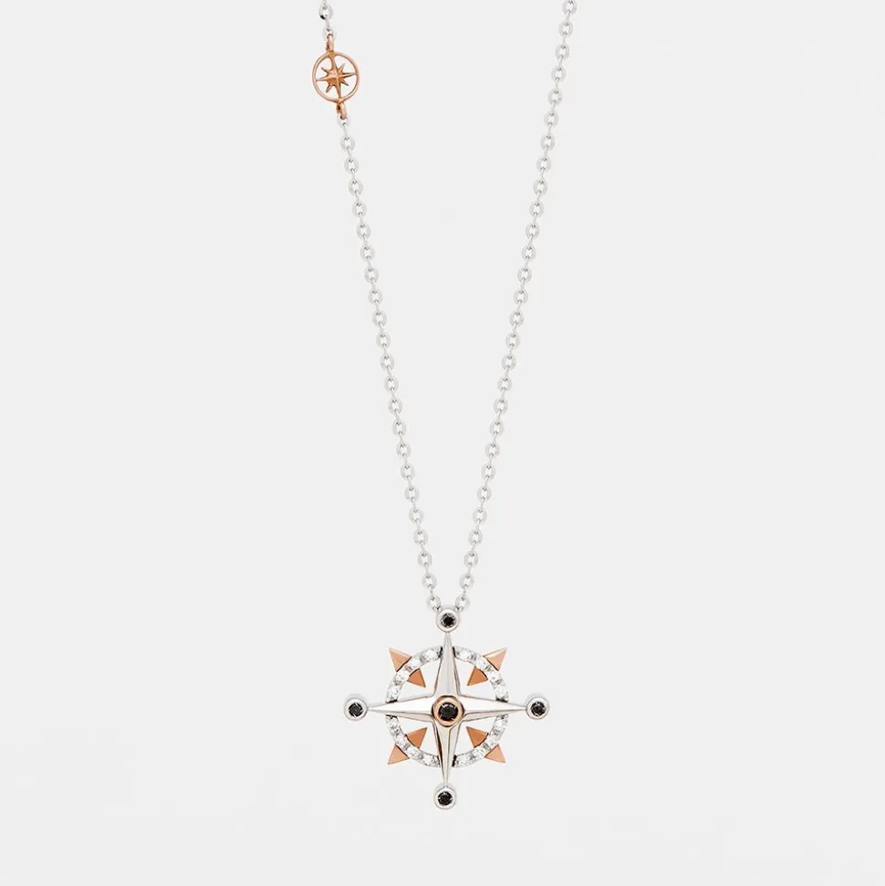 Collana zancan in oro con pendente rosa dei venti e diamanti.
